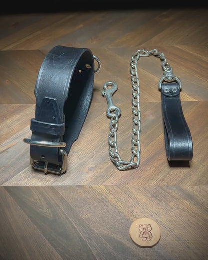 Demonstrating the flexibility and buckle fastening of a 1.75" black leather collar with nickel-plated steel hardware.