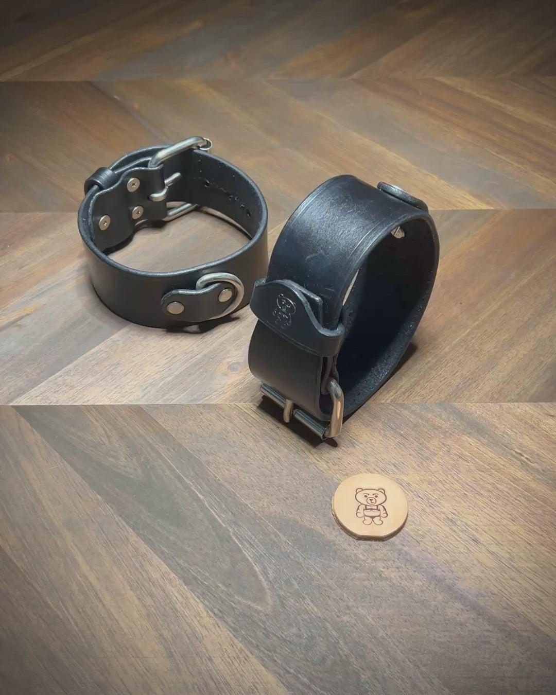 Hand-buckling and demonstrating the tensile hardware stability of a 1.75" black leather cuff with nickel-plated steel components.