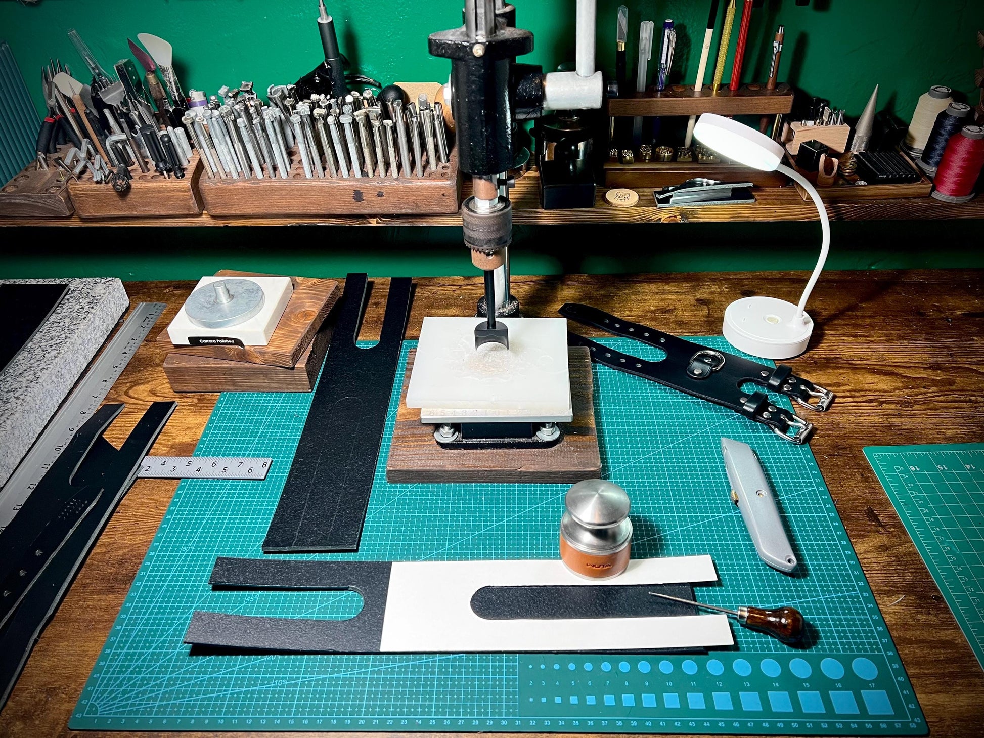 Workbench with tools and materials on a green background